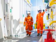 Two employees walking on the Valaris Renaissance (DS-15) rig on the Lapa field